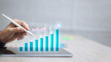 Business Growth Graph Data Analysis on Digital Tablet with Stylus