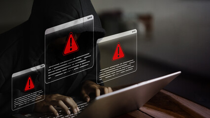 Cybersecurity Threat Hacker with Red Alert Warning on Laptop Computer