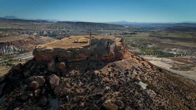 Drone view of the medieval Alcal&aacute; Castle on a hill in Mula, Murcia Region, Spain.