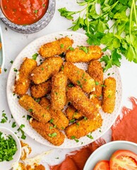 Crispy, golden mozzarella sticks on a plate