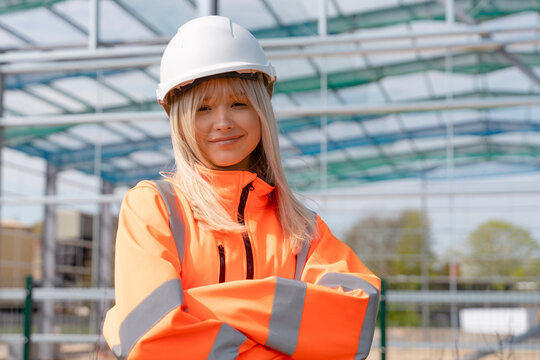 Portrait of a proud young building development manager in front of steel frame structure erected on construction site