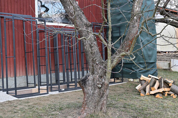 Iron decorative firewood stands for winter near house 