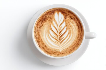 Overhead view of a latte art coffee drink in a white ceramic mug.  A delicate leaf pattern is created on the surface of the frothed milk