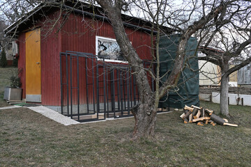 Iron decorative firewood stands for winter near house 