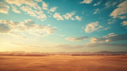 Fototapeta premium A vast desert landscape under a bright sky, featuring soft dunes and a colorful array of clouds at sunset.