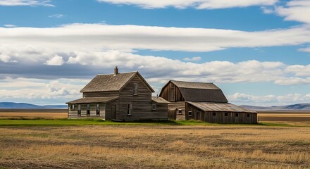 Obraz premium Old Abandoned Farmhouse in a Vast Field Under a Cloudy Sky.