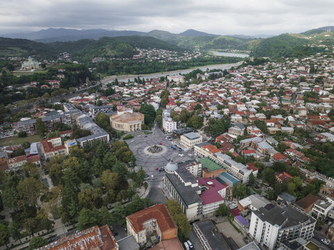 Aerial view of the vibrant city unfolds, with the Tskaltubo Sanatoriums and Rioni River amidst the distant rolling green hills, Kutaisi, Imereti, Georgia.
