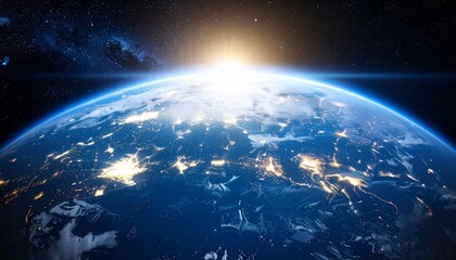 Obraz premium Earth seen from space, with city lights illuminating continents, and a sunrise.