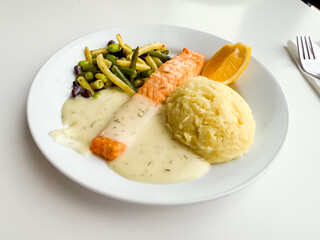 Plate with salmon, mashed potatoes and vegetables. Healthy eating, balanced nutrition and traditional lunch option.