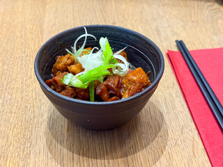 Bowl of braised meat with green onion garnish. Asian cuisine, traditional dining and oriental food culture.