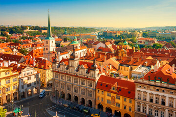Aerial view of Old Town architecture in Prague, Czech Republic. Picturesque view of red roofs of houses in Prague. Famous tourist attractions in Prague, Czech Republic.