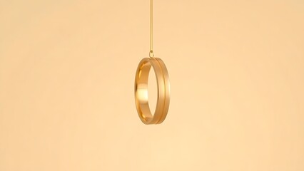 Three golden wedding bands suspended vertically against a soft beige backdrop.
