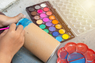 Asian kid child little girl painting craft with colourful watercolor, creativity activity concept