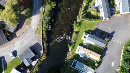 Scenic drone view of caravan holiday park in natural landscape – ideal for tourism, recreation,...