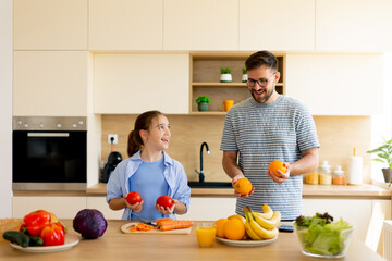 Cooking together with joy in a bright kitchen on a sunny day