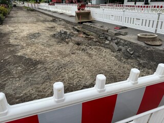 Construction Site Featuring a Barricade as Well as Ongoing Excavation Activities
