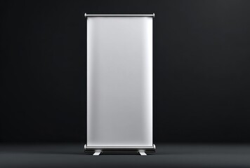 Empty Silver Roll-up Banner Stand on Black Background for Presentation or Display