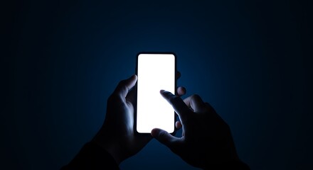 A person's hands holding and interacting with a glowing smartphone screen against a dark background.