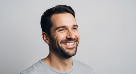 Portrait of a young man with a genuine smile and a hopeful gaze
