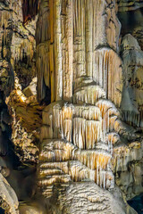 Illuminated flowstone formations in Postojna Cave
