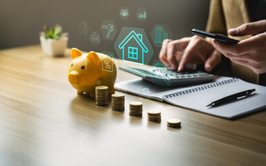 Financial planning and real estate investment concept with businessman stacking coins, calculating...