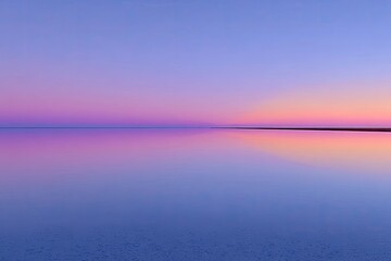 Calm, tranquil water reflecting a vibrant pastel sunset