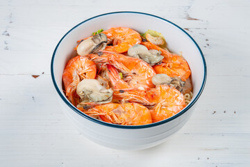 angle view fresh seafood rice noodles with shrimps and oysters at horizontal composition