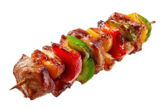 Shashlik isolated on white background. The skewer is long and has a variety of colorful vegetables on it