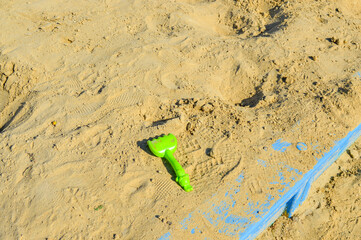 children’s sandbox colorful wooden outdoor playground sand small green toy shovel inside...
