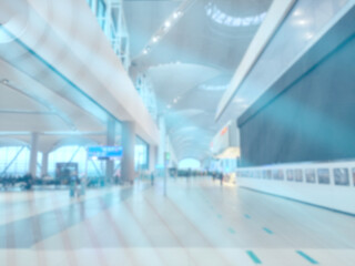 Blurry hall with people. Defocused space with bursting lights