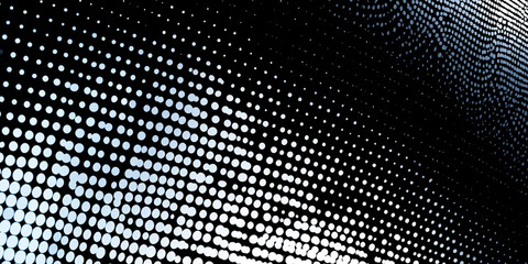 A black background with a pattern of white circles of varying sizes and densities creating a gradient effect.