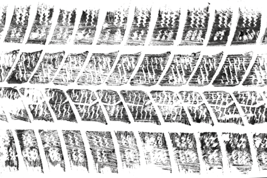 black traces of tractor tires on white background.