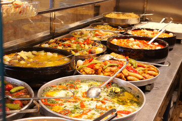 Colorful display of traditional dishes at a local market