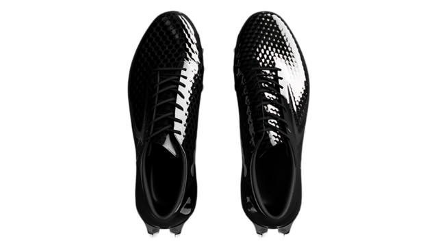 Illustration of a pair of black football shoes isolated on transparent background, showcasing the design and features of modern athletic footwear for sports performance and style