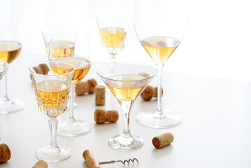 Set of glasses of yellow wine at wine tasting