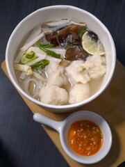Tekwan Palembang fish soup with noodles and vegetables for culinary background