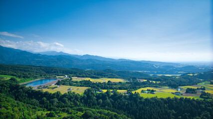 View of Toyama Bay, the Kurobe River alluvial fan, the Hokuriku Shinkansen, and farms from Kurobe City in eastern Toyama Prefecture, Japan