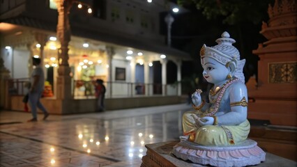Hindu Temple at Night with Krishna Statue
