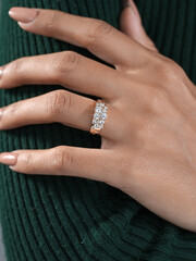 A woman's elegant finger ring with a white diamond