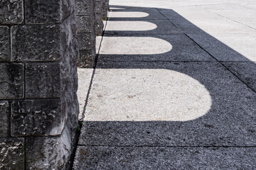 stone arches shadows on textured concrete floor. stone architecture. concrete surface. stone building. architectural concept. architectural background with arches shadows