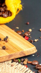 Coffee beans and spices on a wooden board