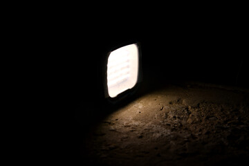 flashlight and light beam in dark mist room at night . abstract projector spotlight white lay