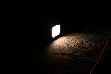 flashlight and light beam in dark mist room at night . abstract projector spotlight white lay