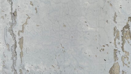 old peeling white wall texture with cracked paint and weathered surface