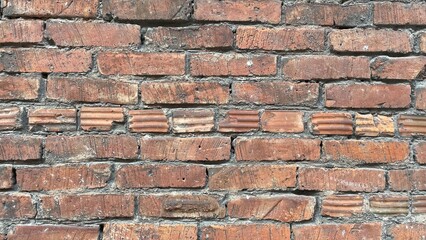 Obraz premium wide red brick wall texture with vintage worn surface and old masonry pattern