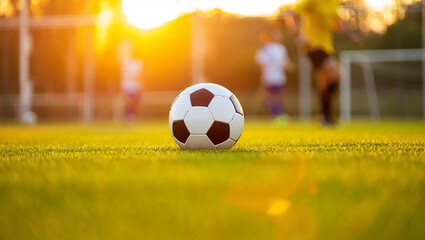 Obraz premium Fast Football Play – Challenging for the Ball on Field