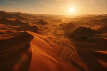 Drone aerial view of Namibian desert dunes at golden hour, showcasing endless ridges and glowing sand valleys.