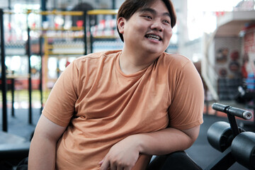 Happy Overweight Man Smiling After Workout at Gym