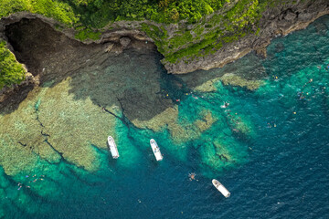 Aerial View of Blue Cave (青の洞窟) and Diving Boats at Maeda Misaki, Okinawa, Japan
