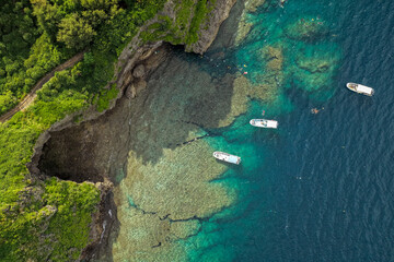 Aerial View of Blue Cave (青の洞窟) and Diving Boats at Maeda Misaki, Okinawa, Japan